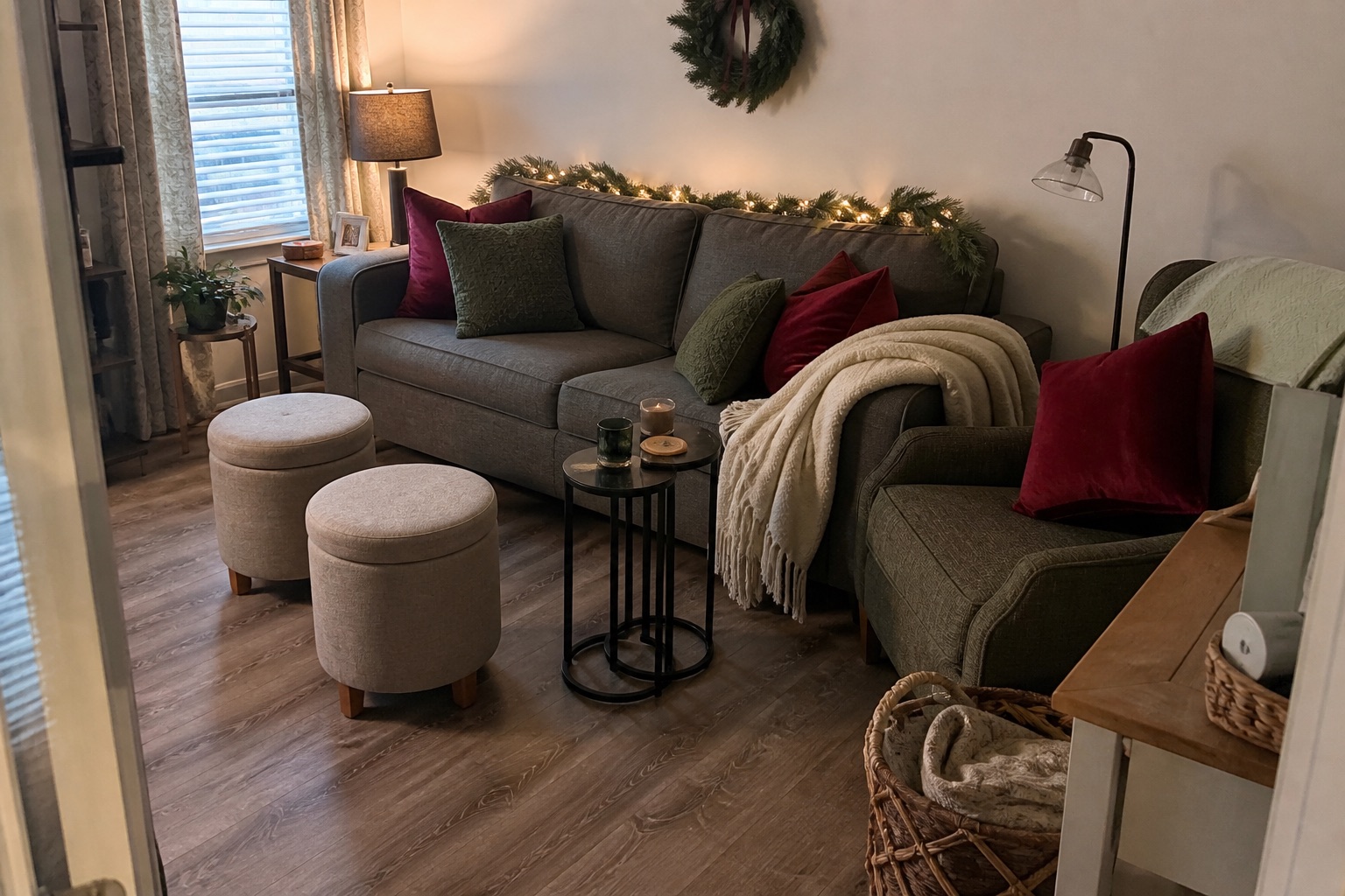A holiday hosting living room with flexible seating, layered lamps, greenery and a clear walking path