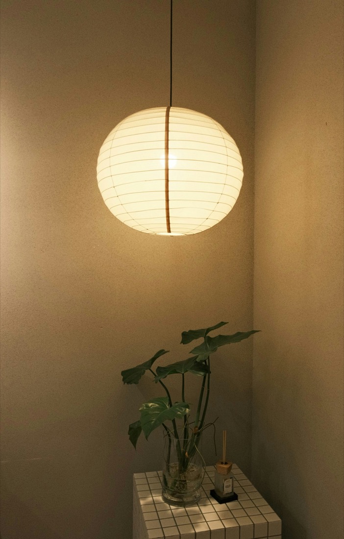 A paper lantern casting a soft, warm glow
